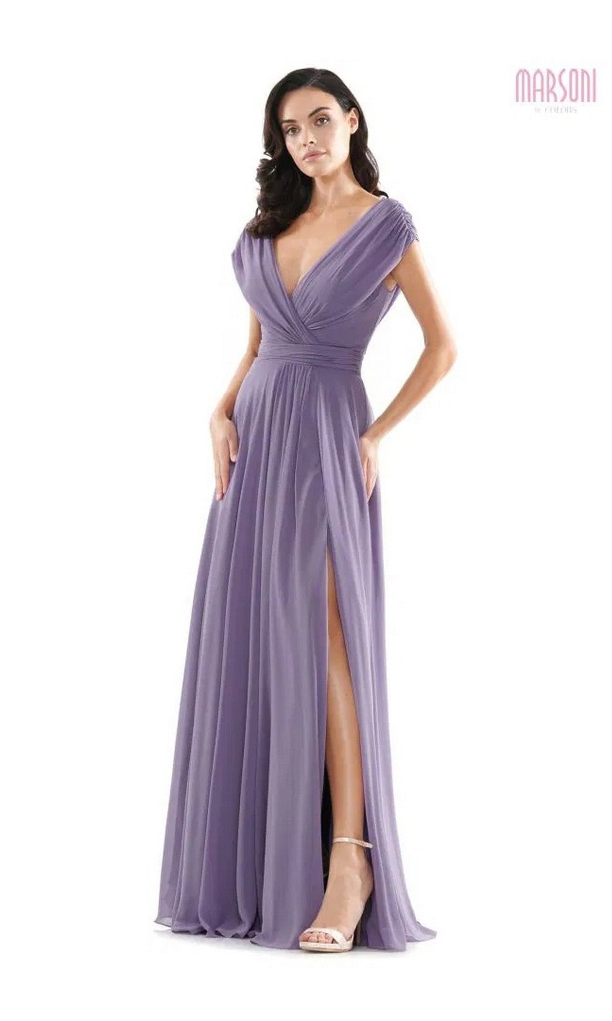 A woman wearing the Marsoni M251 long formal dress in lavender chiffon, featuring a deep V-neckline, cap sleeves, and high leg slit, stands against a white background.